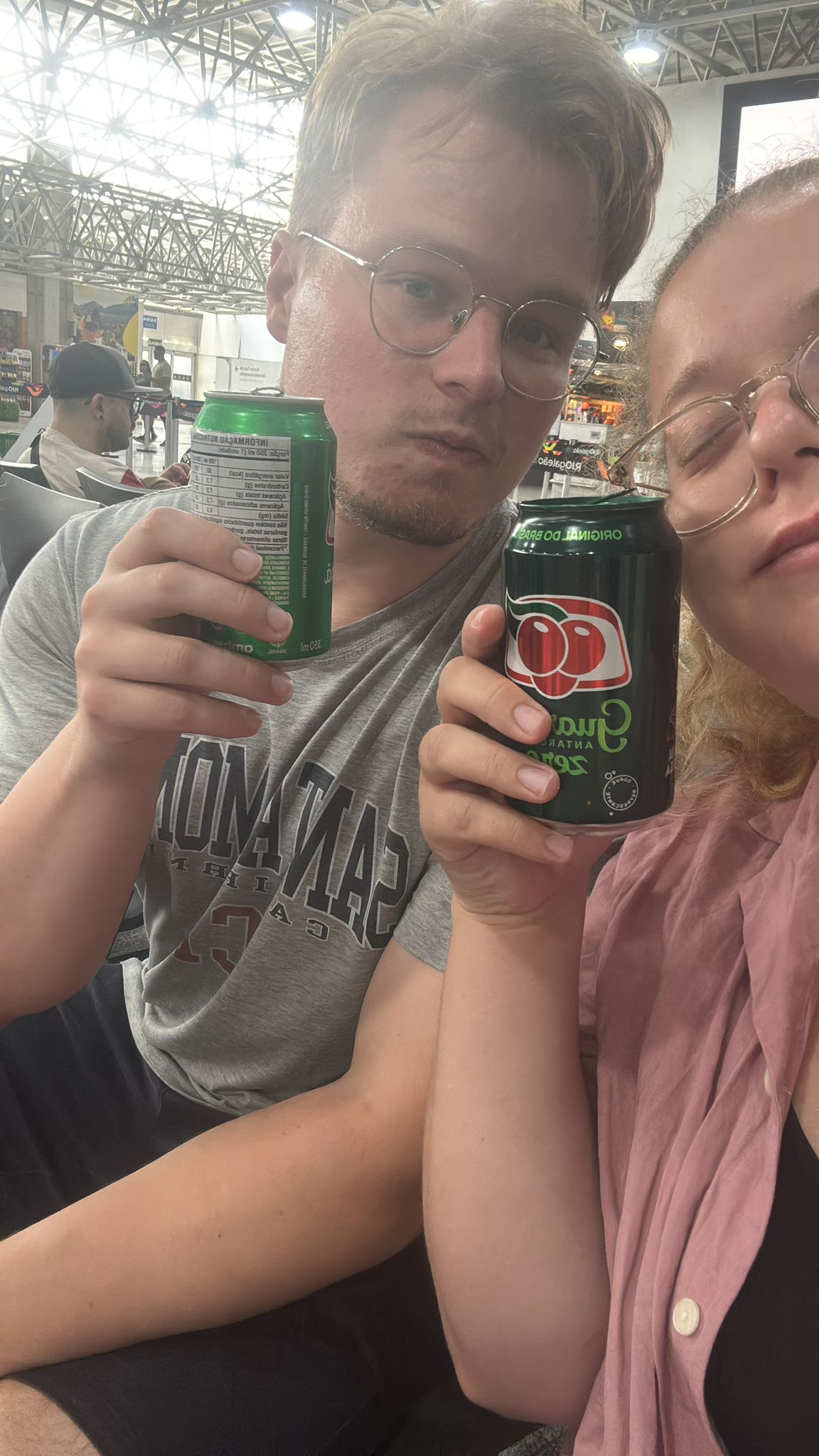 Dan and a companion holding Brazilian drinks